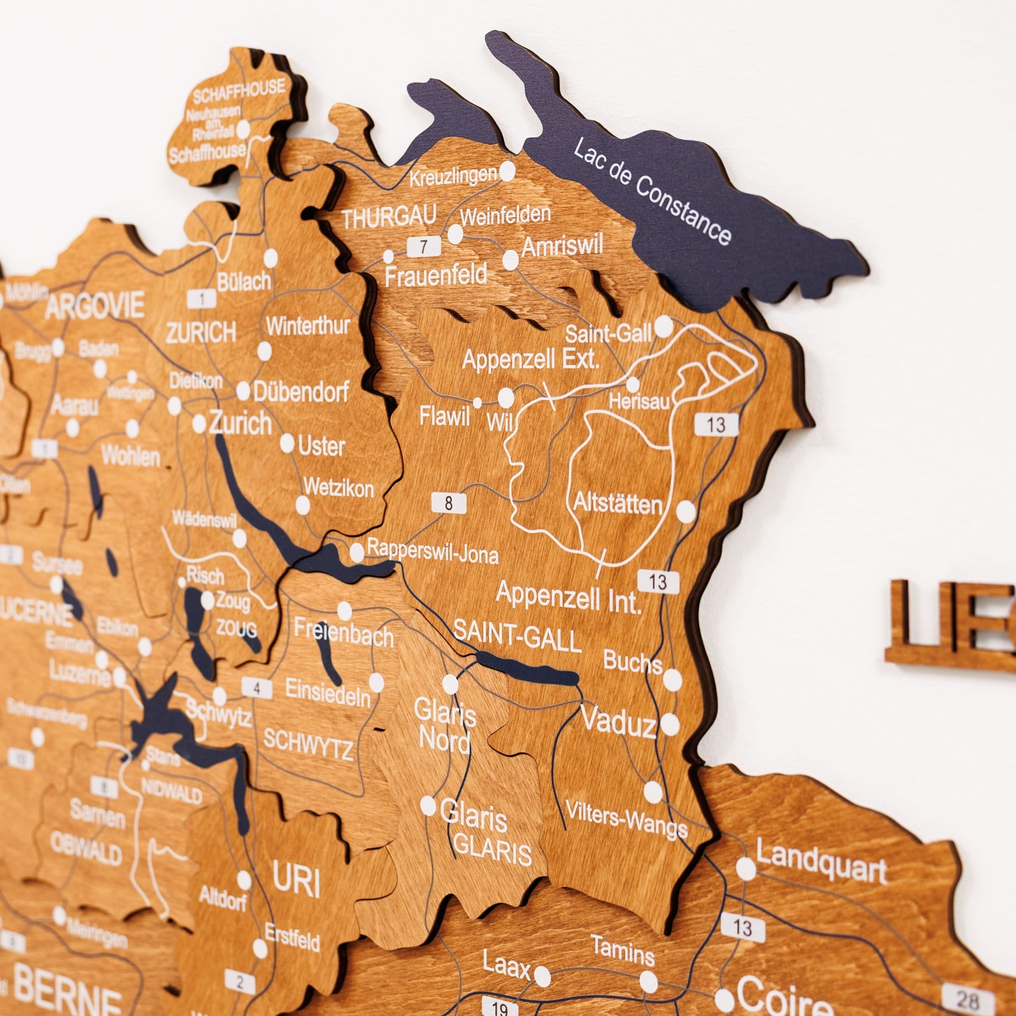 Wooden puzzle map of Switzerland with regions labeled