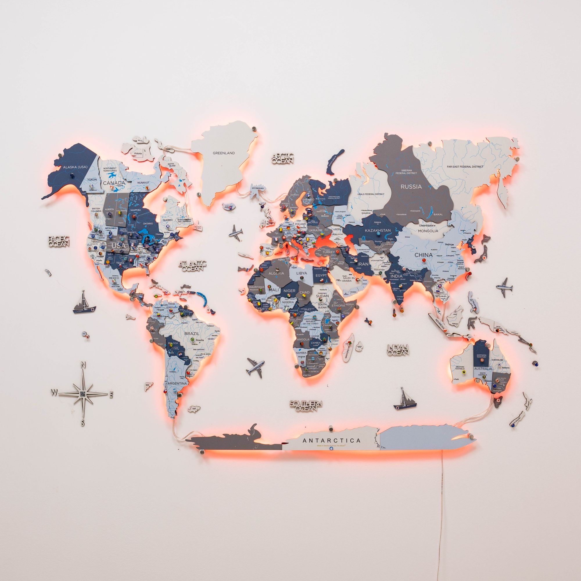 World map with glowing edges on a light gray background