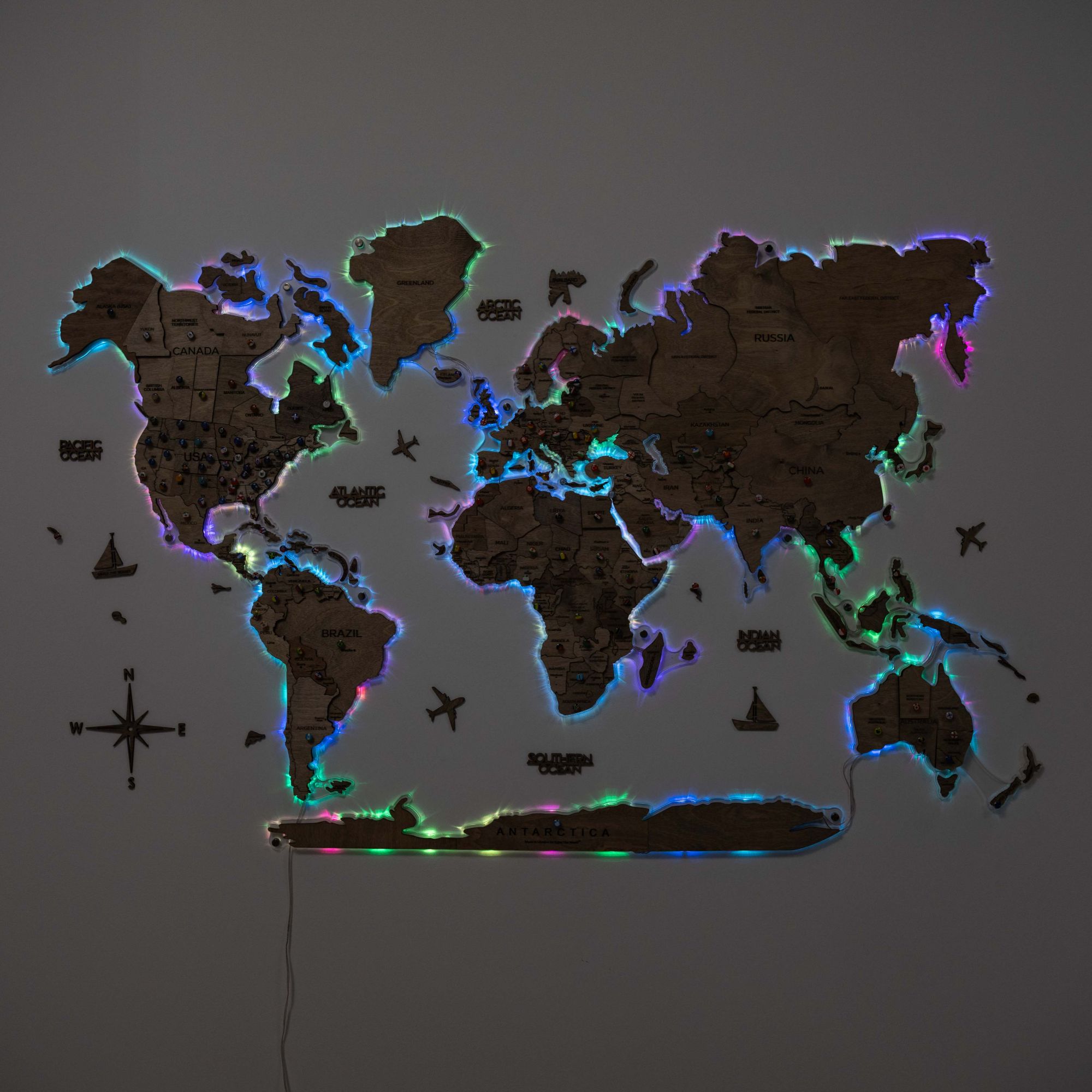 World map with colorful lighting on a dark background